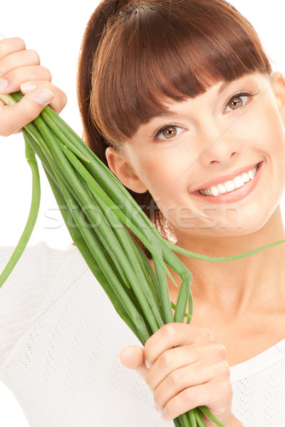 beautiful housewife with spring onions over white Stock photo © dolgachov