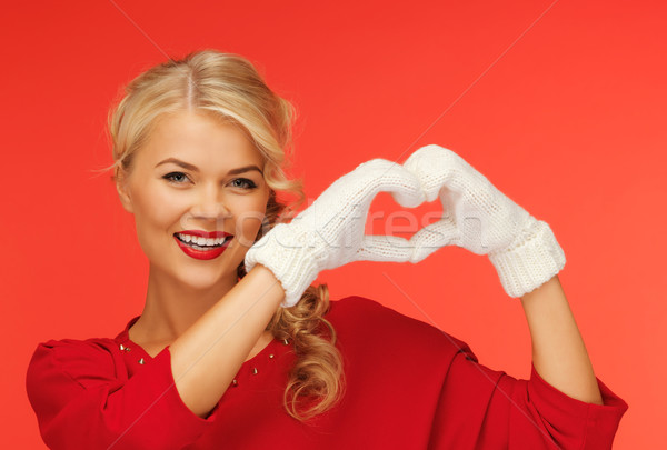 lovely woman showing heart shape Stock photo © dolgachov