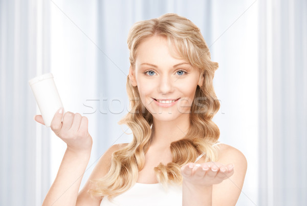 young woman with pills Stock photo © dolgachov