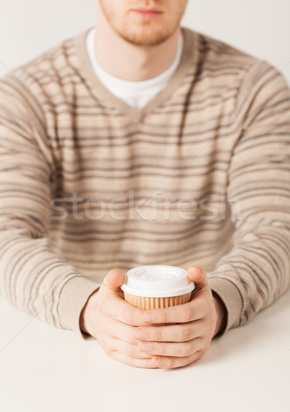 man hand holding take away coffee cup Stock photo © dolgachov