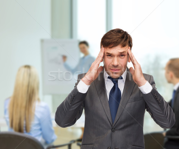 stressed buisnessman or teacher having headache Stock photo © dolgachov
