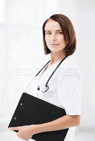 doctor with stethoscope and clipboard Stock photo © dolgachov