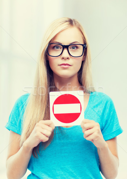 woman with no entry sign Stock photo © dolgachov