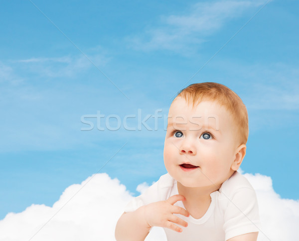 smiling baby looking up Stock photo © dolgachov