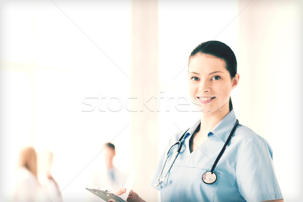female doctor or nurse in hospital Stock photo © dolgachov