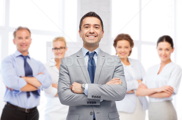 happy smiling business team over office room Stock photo © dolgachov