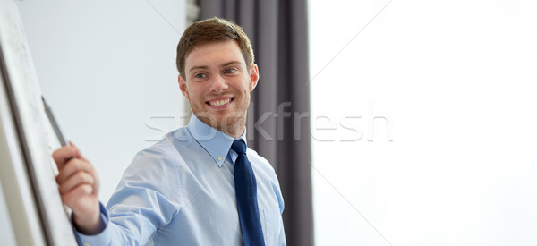 Sorridere imprenditore presentazione ufficio uomini d'affari punta Foto d'archivio © dolgachov