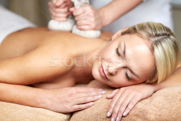 close up of woman lying on massage table in spa Stock photo © dolgachov