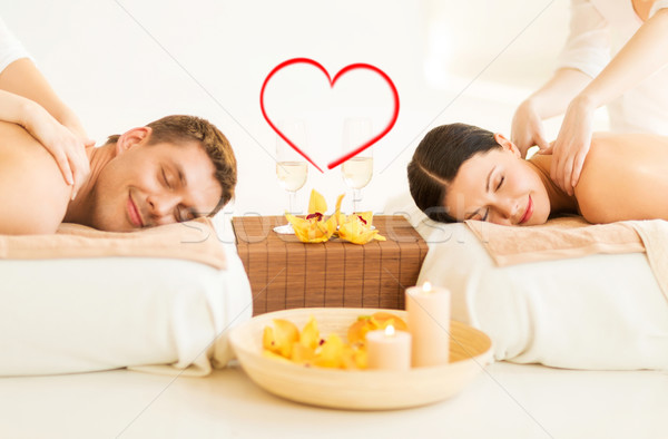 couple getting massage in spa salon Stock photo © dolgachov