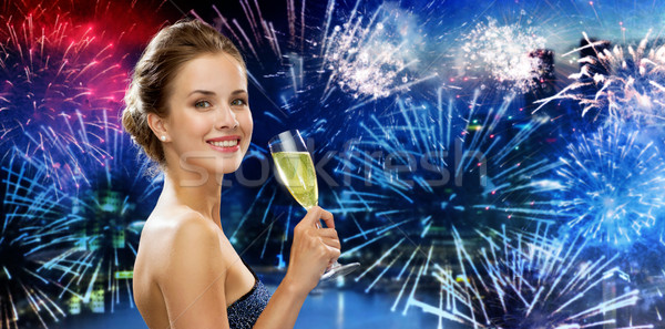 счастливым женщину питьевой шампанского фейерверк вечеринка Сток-фото © dolgachov