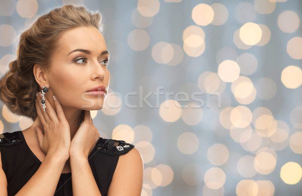Gyönyörű nő visel fülbevalók fények emberek ünnepek Stock fotó © dolgachov