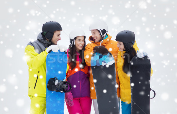 happy friends in helmets with snowboards talking Stock photo © dolgachov