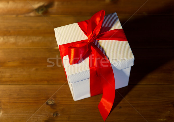 close up of christmas  gift box on wooden floor Stock photo © dolgachov