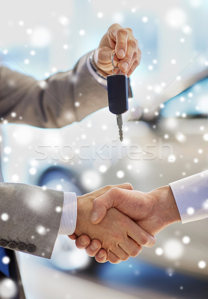 close up of handshake in auto show or salon Stock photo © dolgachov