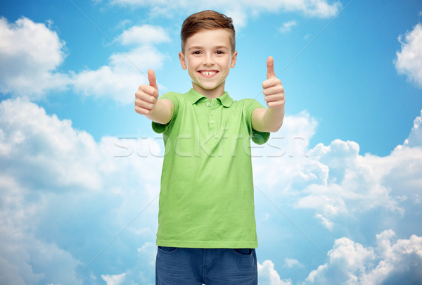 happy boy in green polo t-shirt showing thumbs up Stock photo © dolgachov