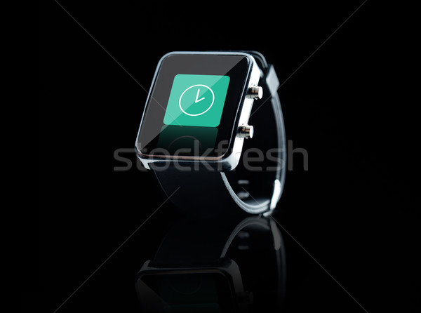 close up of black smart watch with clock icon Stock photo © dolgachov