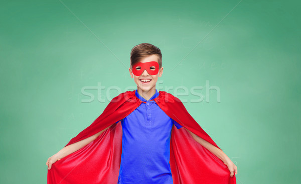 boy in red super hero cape and mask Stock photo © dolgachov
