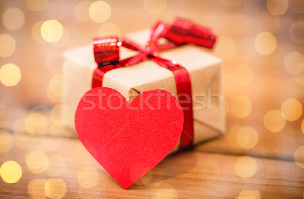 close up of gift box and heart shaped note on wood Stock photo © dolgachov