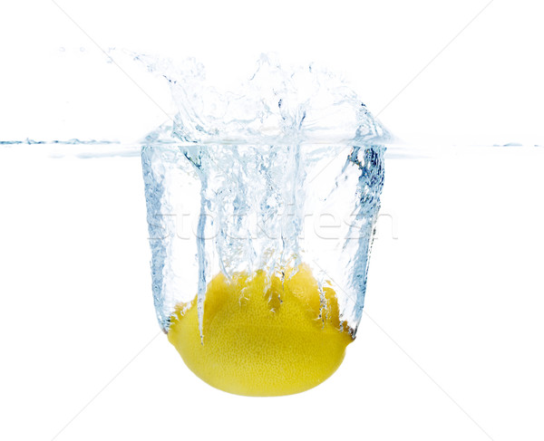 lemon falling or dipping in water with splash Stock photo © dolgachov