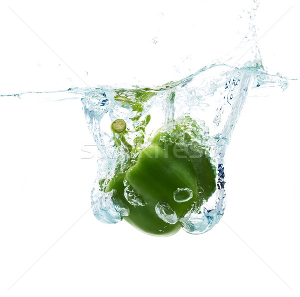 pepper falling or dipping in water with splash Stock photo © dolgachov