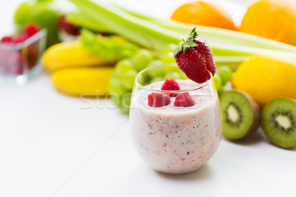 close up of glass with milk shake and fruits Stock photo © dolgachov