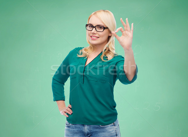 Gülen genç kadın gözlük neden vizyon Stok fotoğraf © dolgachov