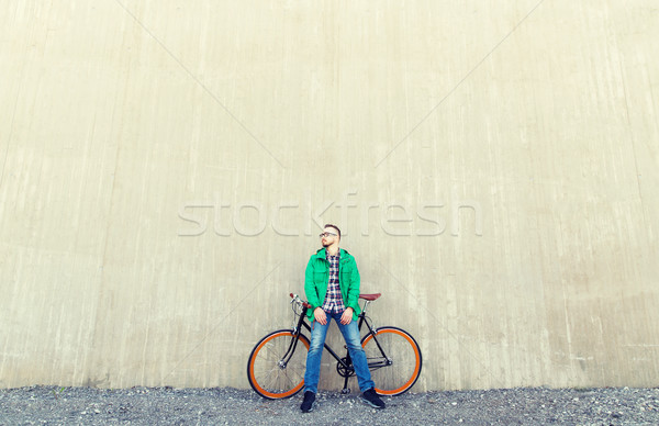 happy young hipster man with fixed gear bike Stock photo © dolgachov