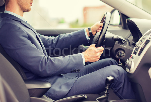 close up of young man in suit driving car Stock photo © dolgachov