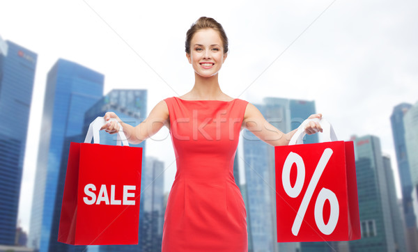 happy woman with shopping bags over singapore city Stock photo © dolgachov