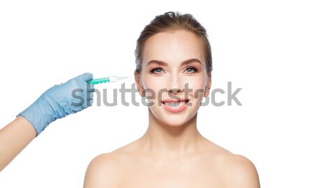 Visage de femme main seringue injection personnes Photo stock © dolgachov