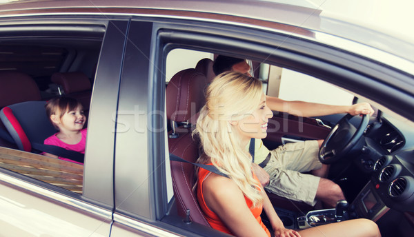 happy family with little child driving in car Stock photo © dolgachov