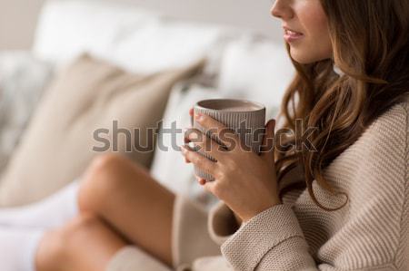 happy woman with cup of cocoa in bed at home Stock photo © dolgachov