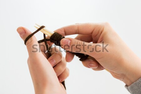 close up of hands knitting with needles and yarn Stock photo © dolgachov