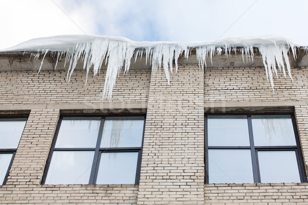icicles on building or living house facade Stock photo © dolgachov