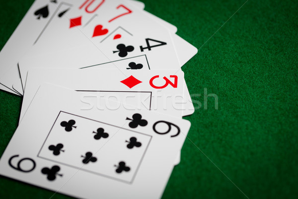 Poker mano carte da gioco verde casino panno Foto d'archivio © dolgachov