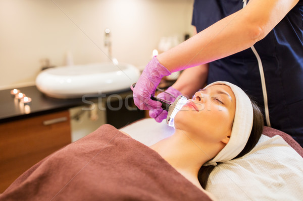 young woman having face microdermabrasion at spa Stock photo © dolgachov