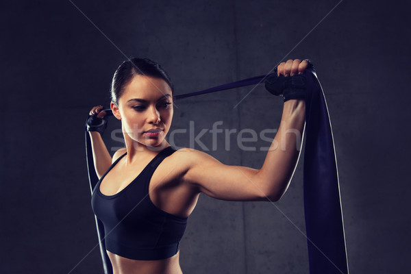 woman with expander exercising in gym Stock photo © dolgachov