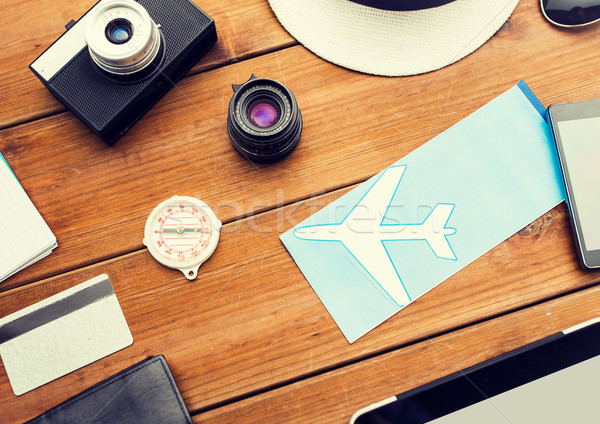 close up of camera and traveler personal stuff Stock photo © dolgachov