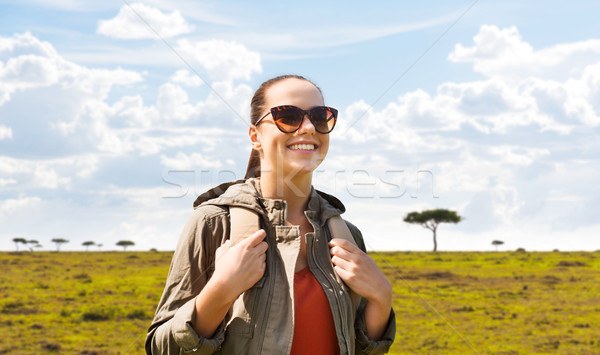 Stock photo: happy woman with backpack traveling in africa