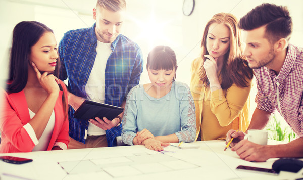 creative team with blueprint working at office Stock photo © dolgachov