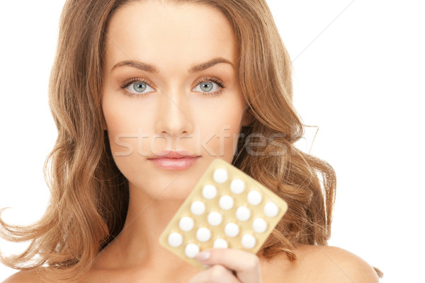 young beautiful woman with pills  Stock photo © dolgachov
