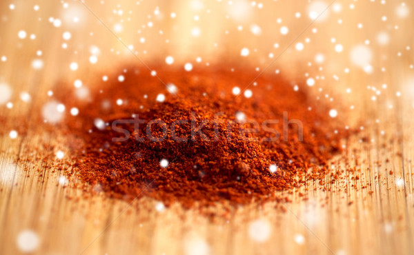 cayenne pepper or paprika powder on wood Stock photo © dolgachov
