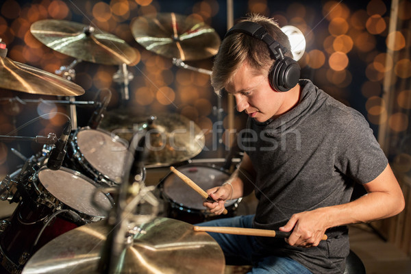 musician playing drum kit at concert over lights Stock photo © dolgachov