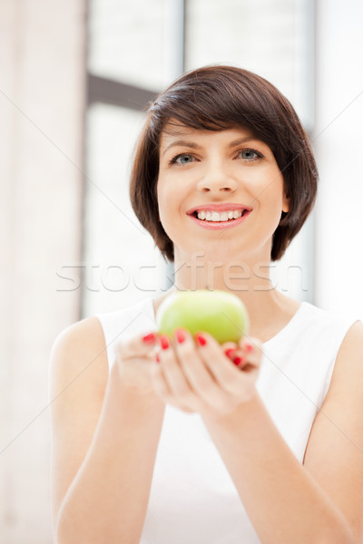 lovely housewife with green apple Stock photo © dolgachov