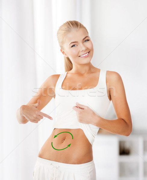 Stock photo: woman with arrows on her stomach