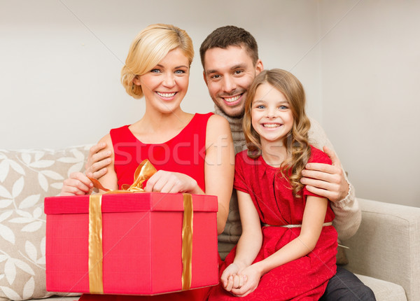 Stock photo: happy family opening gift box