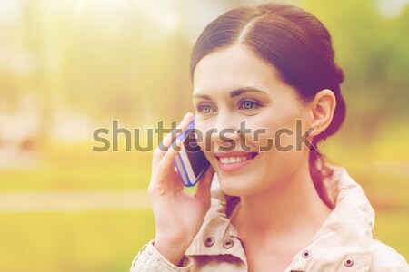 beautiful woman spraying pefrume on her neck Stock photo © dolgachov