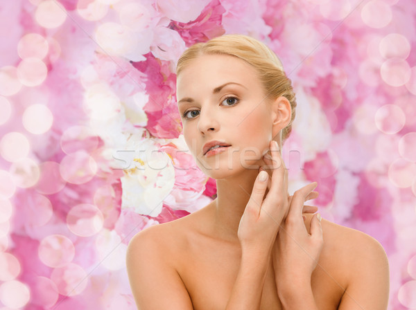 beautiful woman touching her face skin Stock photo © dolgachov