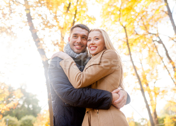 smiling couple hugging in autumn park Stock photo © dolgachov