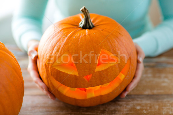 close up of woman with pumpkins at home Stock photo © dolgachov